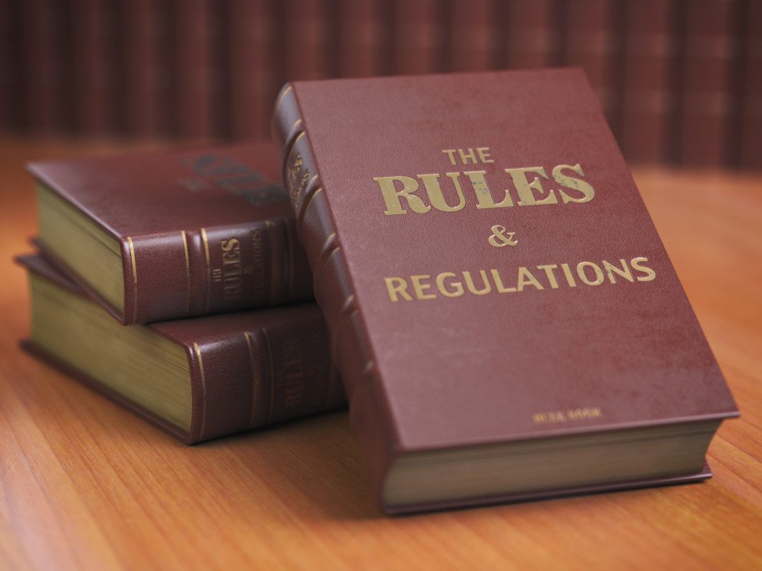 Rules an regulations books with official instructions and directions of organization or team.
