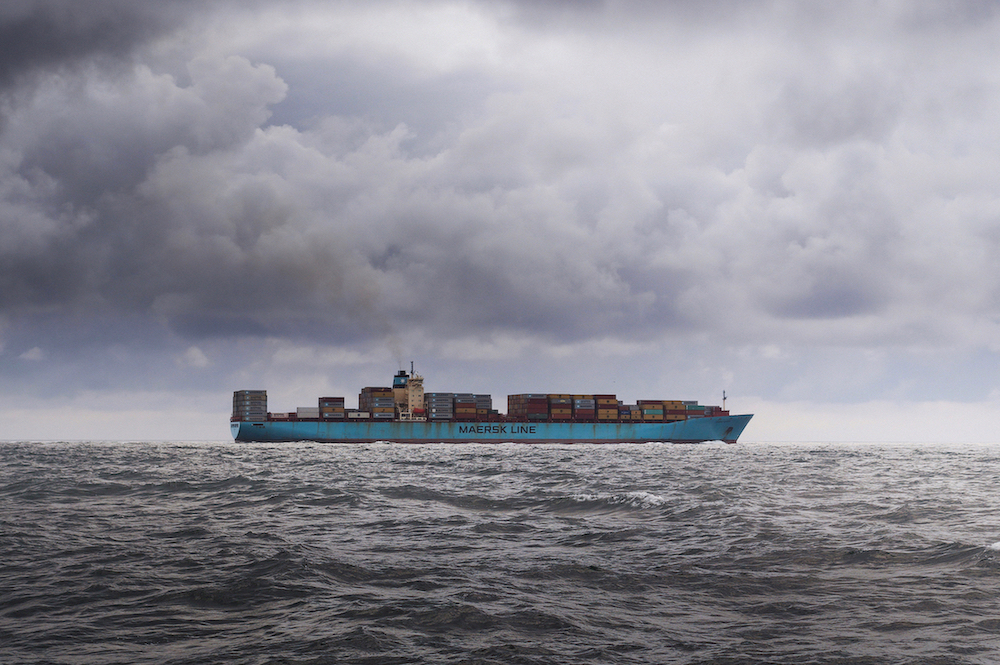 Canva - Blue Cargo Ship on Sea Under White Clouds (1)